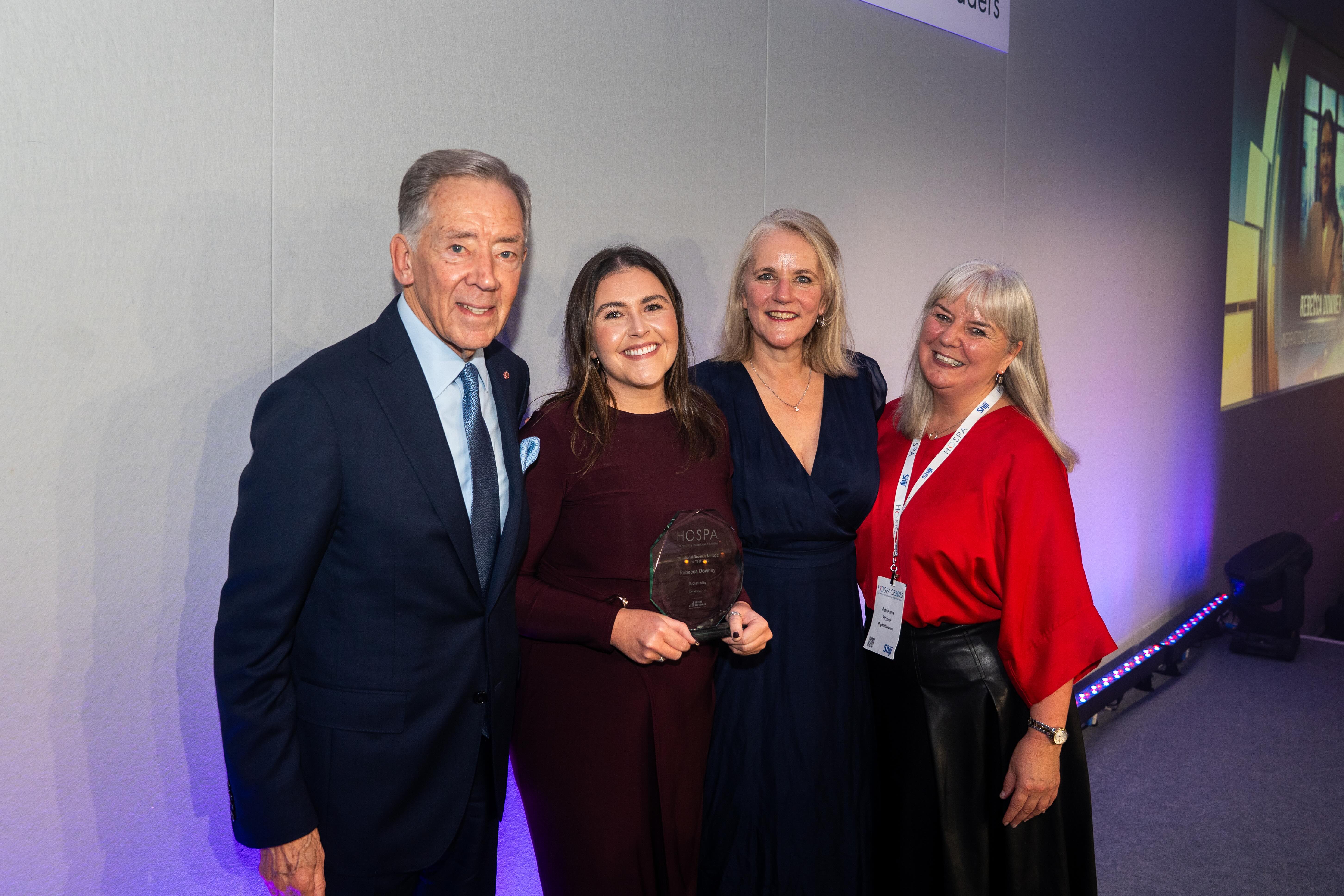 Four attendees pose with a HOSPA award at an awards event, in the photograph supplied with the 2026 shortlist announcement.
