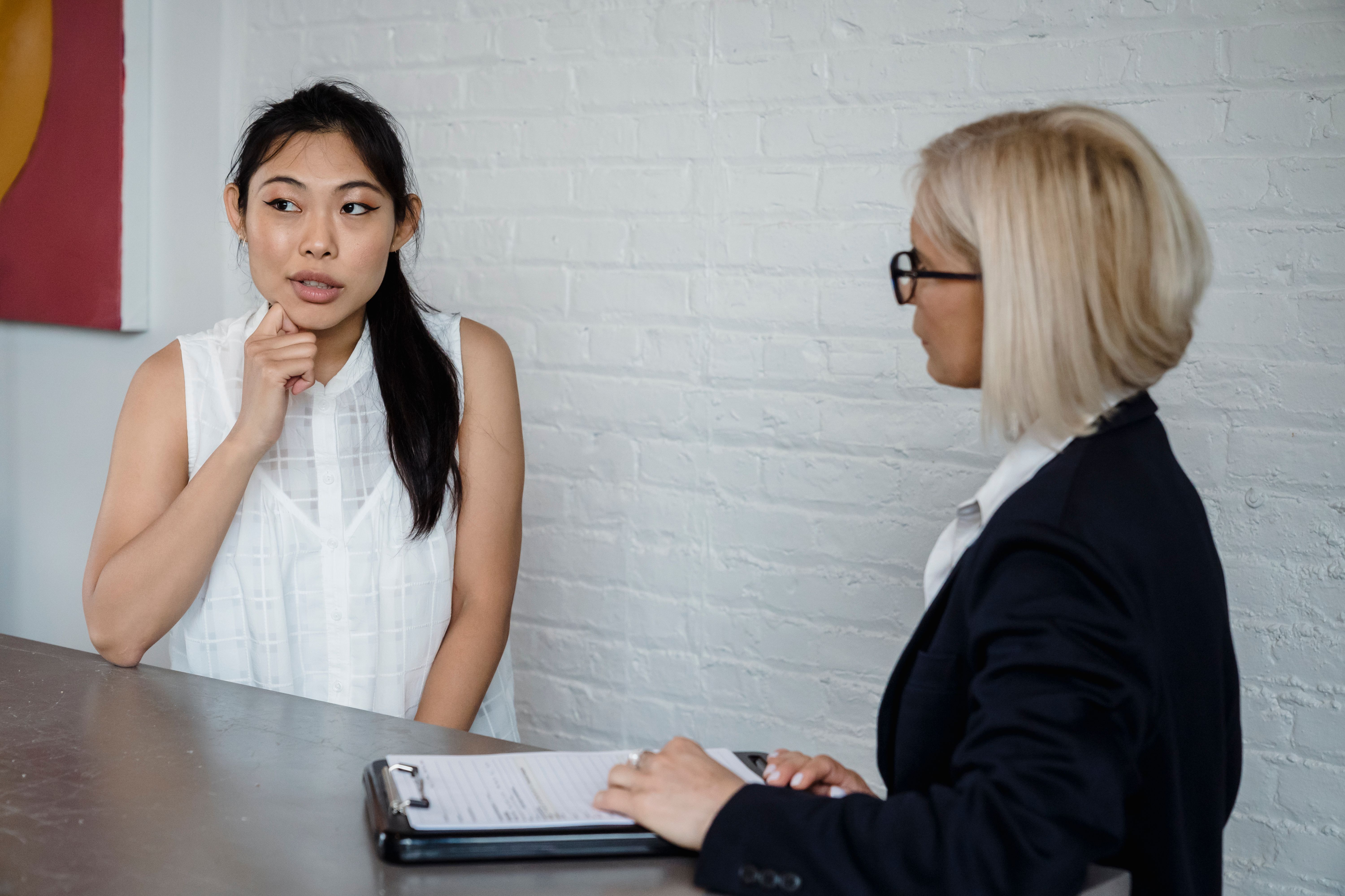 Two women in a professional discussion; illustrative stock photo