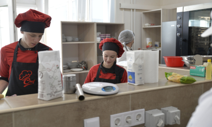 Culinary students training in a professional kitchen