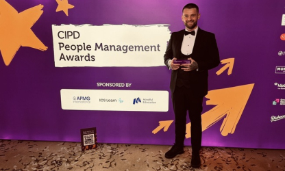 Christopher Brennan holding his commendation at the CIPD People Management Awards