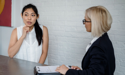 Two women in a professional discussion; illustrative stock photo